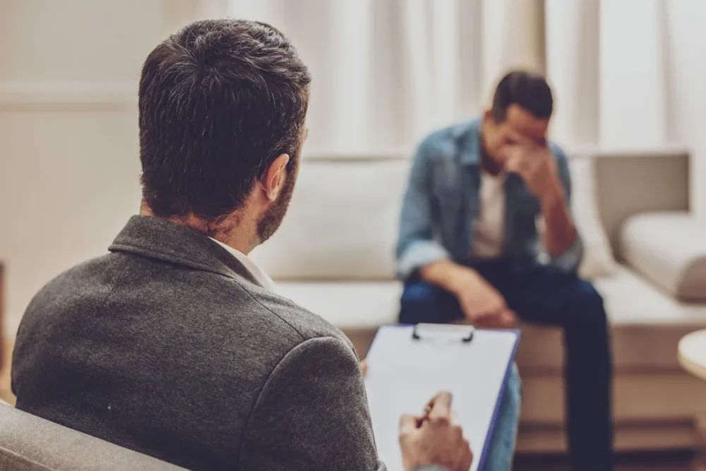 Man receiving individual therapy for addiction with his counselor in Memphis, Tennessee Man receiving individual therapy for addiction with his counselor in Memphis, Tennessee