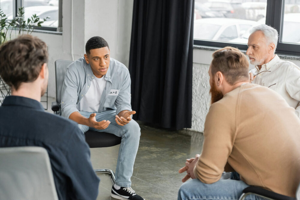 Group of men in a therapy session discussing fentanyl addiction treatment in Memphis, Tennessee