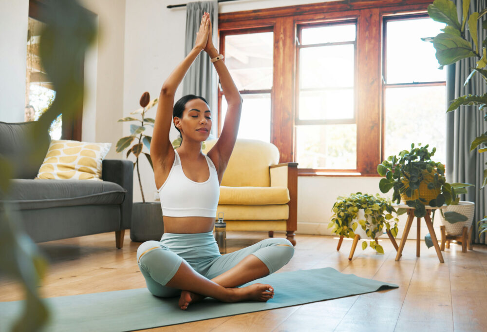 woman practicing yoga as part of holistic therapy