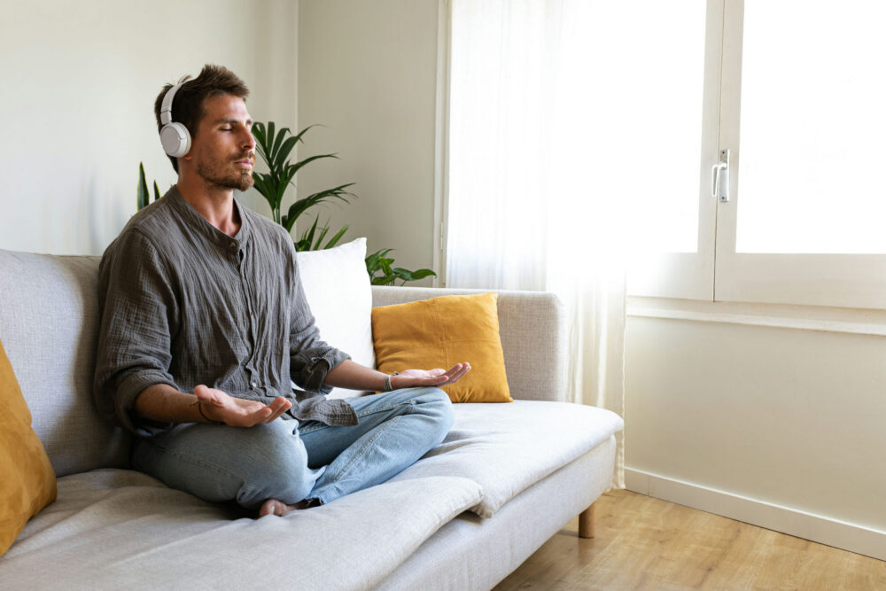 yoga-therapy-addiction-treatment man doing yoga for addiction recovery